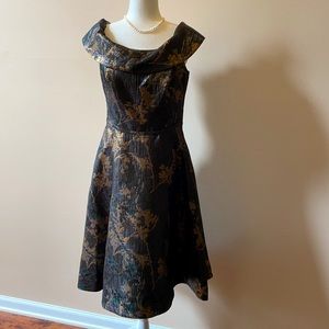Elegant black and gold cocktail dress by Teri Jon